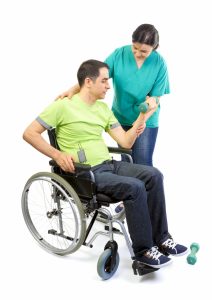 Fitness Trainer with patient in a wheelchair