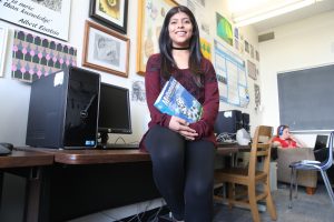 Mathematics student sitting on a desk