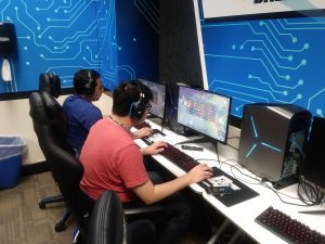 Jose Mejia and Justin Fang playing League of Legends in the esports room