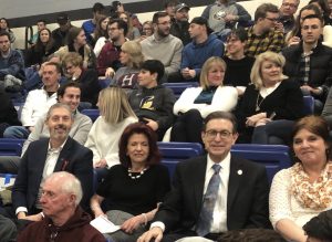 President Gary Olson, Dr. Lynn Worsham, and Faculty Senate leaders Dr. Greg Ford and Dr. Lisa Parshall cheer on the men’s volleyball team in their match against Harvard.