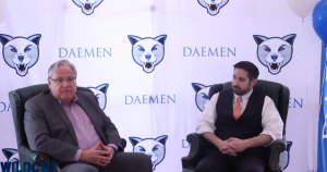 Dr. Michael Brogan and Dr. Greg Nayor sitting down infront of a Daemen backdrop