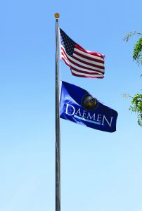 US and Daemen flag on the flag pole in front of RIC