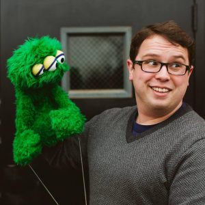 Cameron Garrity holding a puppet