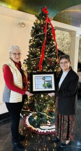 Rebecca McCormick-Boyle and Sister Jo-Anne Grabowski ‘73 stand with certificate of appreciation.