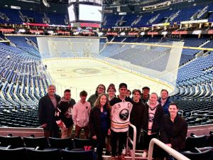 Sports management students and faculty members attend a Buffalo Sabres game at the KeyBank Center.