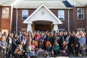 Jenny's mom poses with Daemen faculty, staff, students and friends at Jenny's memorial on campus