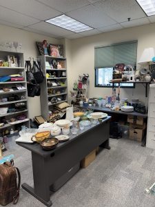 Room with shelves and desks filled with houseware items