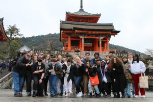 Group of students standing in front of the Kiyomizu-dera Temple in Kyoto, Japan